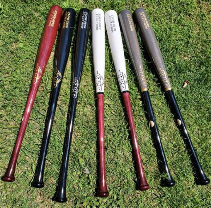 Does an aluminum bat hit farther than a wooden bat?