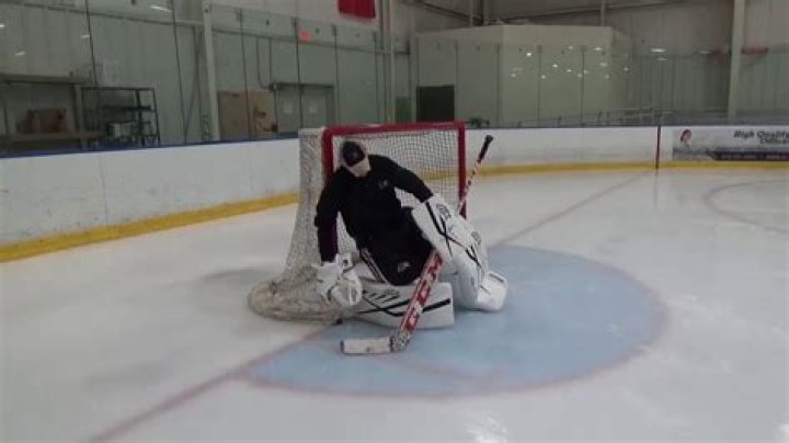 How far can a goalie come out in hockey?