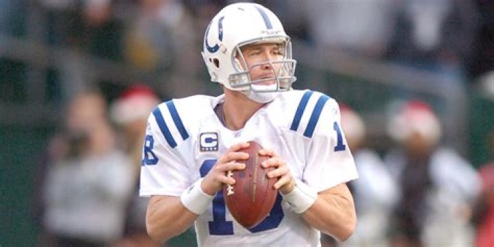 How many interceptions did Peyton Manning have in his first season?