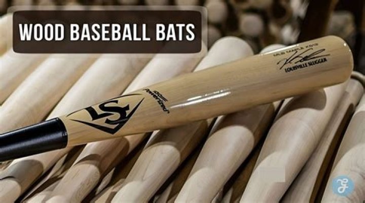 Which bat hits farther wood or metal?