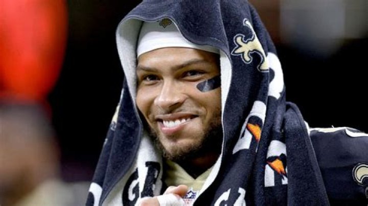 Why do football players wear towels on their head?