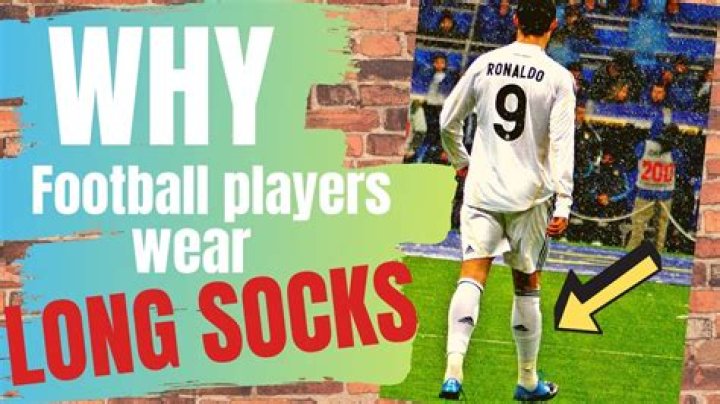 Why do footballers wear low socks?