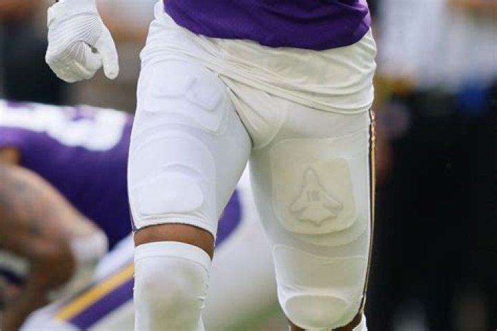 Why do NFL players wear thigh pads?