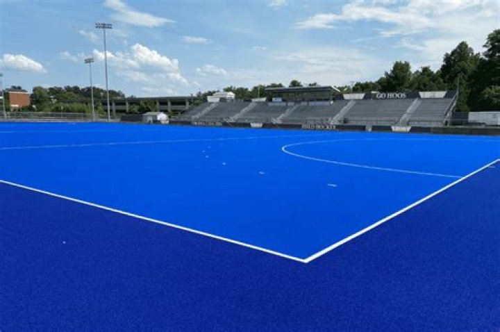 Why is field hockey on blue turf?